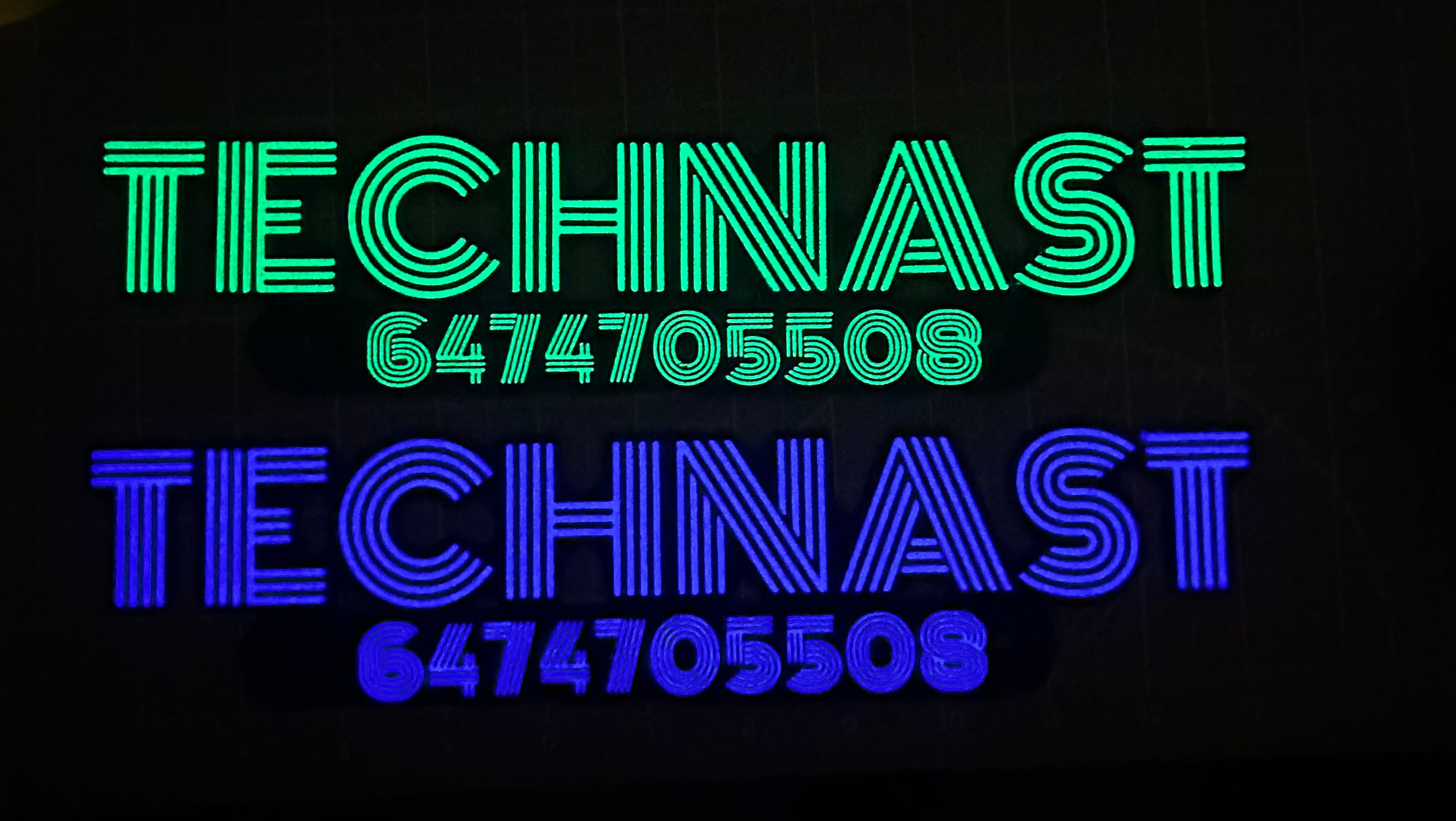 Two Technast logos with contact numbers glowing side by side in green and blue, demonstrating color variation in glow-in-the-dark materials.