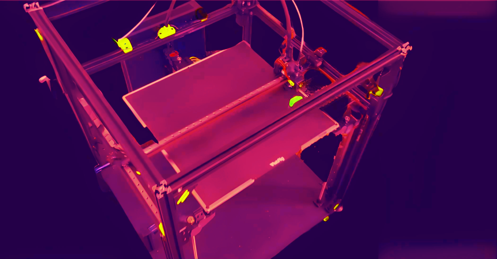 Showcasing Technast's Large-Scale FDM Printer in Action Dive into the vibrant world of large-scale 3D printing with Technast's advanced FDM printer. This image captures the dynamic printing process under striking ultraviolet light, highlighting the printer's extensive build area and robust construction. Perfect for tackling large industrial projects with speed and precision, our printer is the go-to choice for innovative manufacturing solutions.