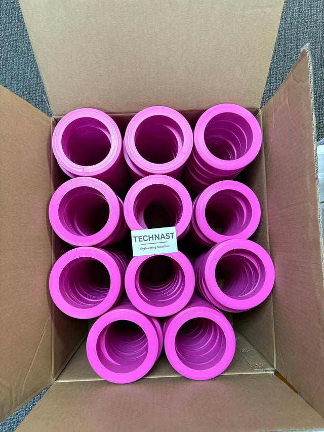 Pink 3D printed display rings stacked in a carton with a TECHNAST card